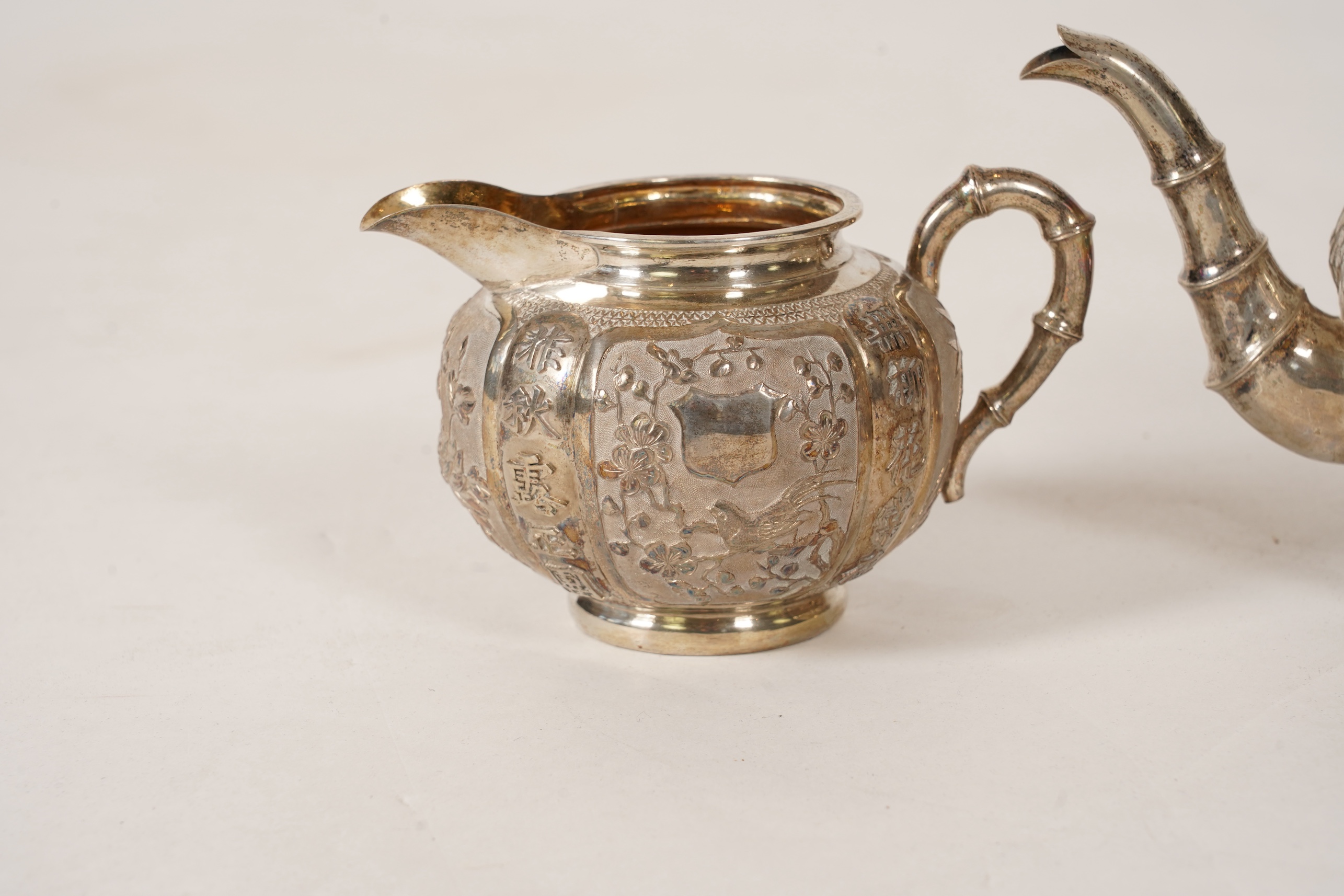 A late 19th/early 20th century Chinese Export white metal three-piece tea set, maker's mark WA